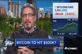 John McAfee challenges Jamie Dimon's bitcoin skepticism